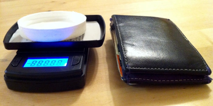 Small digital scale for measuring cream T. Wallet for size comparison.